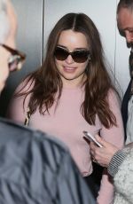 EMILIA CLARKE at Heathrow Airport in London