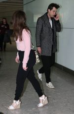 EMILIA CLARKE at Heathrow Airport in London
