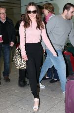 EMILIA CLARKE at Heathrow Airport in London