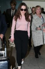 EMILIA CLARKE at Heathrow Airport in London