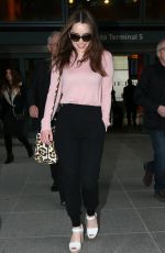 EMILIA CLARKE at Heathrow Airport in London