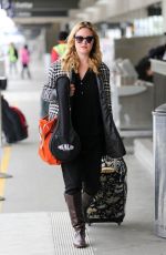 JULIA STILES Arrives at Los Angeles International Airport