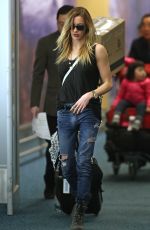 KATIE CASSIDY in Ripped Jeans at Airport in Vancouver