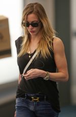 KATIE CASSIDY in Ripped Jeans at Airport in Vancouver