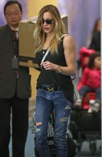 KATIE CASSIDY in Ripped Jeans at Airport in Vancouver