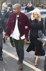 KIM KARDASHIAN and Kanye West at Louis Vuitton Fashion Show in Paris