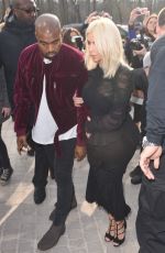 KIM KARDASHIAN and Kanye West at Louis Vuitton Fashion Show in Paris