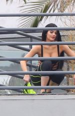 KYLIE JENNER in Cutout Swimsuit on the Set of a Photoshoot in Hollywood