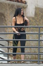 KYLIE JENNER in Cutout Swimsuit on the Set of a Photoshoot in Hollywood