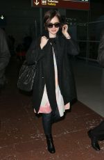 LILY COLLINS at Charles De Gaulle Airport in Paris 0503