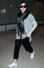 LILY COLLINS at LAX Airport in Los Angeles 0703