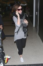 LILY COLLINS at LAX Airport in Los Angeles 0703