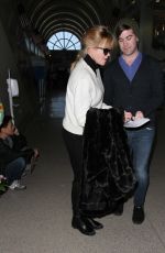 MELANIE GRIFFITH Arrives at LAX Airport in Los Angeles
