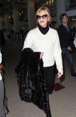 MELANIE GRIFFITH Arrives at LAX Airport in Los Angeles