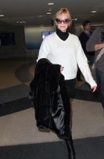 MELANIE GRIFFITH Arrives at LAX Airport in Los Angeles