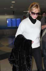 MELANIE GRIFFITH Arrives at LAX Airport in Los Angeles