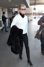 MELANIE GRIFFITH Arrives at LAX Airport in Los Angeles