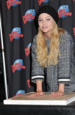OLIVIA HOLT at Planet Hollywood in Times Square in New York