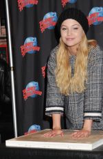 OLIVIA HOLT at Planet Hollywood in Times Square in New York