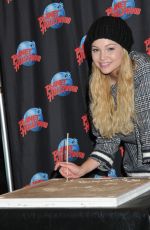 OLIVIA HOLT at Planet Hollywood in Times Square in New York