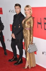 PAMELA ANDERSON at The Gunman Premiere in Los Angeles