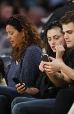 PHOEBE TONKIN and and Paul Wesley at LA Lakers Game