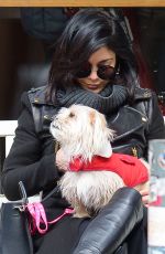 VANESSA HUDGENS Playing with Her Dog in New York