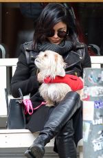 VANESSA HUDGENS Playing with Her Dog in New York