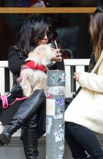 VANESSA HUDGENS Playing with Her Dog in New York