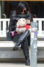 VANESSA HUDGENS Playing with Her Dog in New York