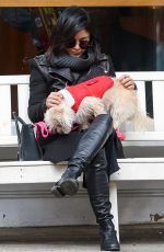 VANESSA HUDGENS Playing with Her Dog in New York