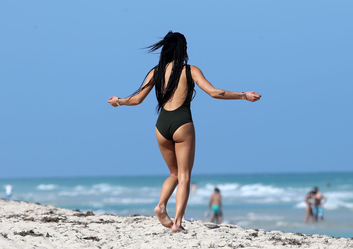 ZOE KRAVITZ in Swimsuit at a Beach in Miami.