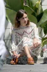 ALEXA CHUNG Taking a Break During a Photoshoot in Los Angeles