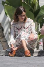 ALEXA CHUNG Taking a Break During a Photoshoot in Los Angeles