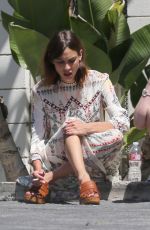 ALEXA CHUNG Taking a Break During a Photoshoot in Los Angeles
