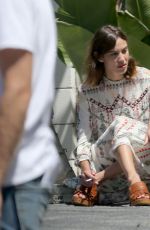 ALEXA CHUNG Taking a Break During a Photoshoot in Los Angeles