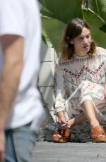 ALEXA CHUNG Taking a Break During a Photoshoot in Los Angeles