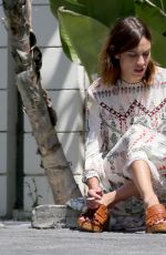 ALEXA CHUNG Taking a Break During a Photoshoot in Los Angeles