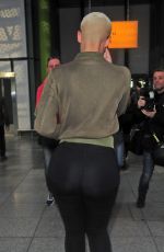 AMBER ROSE at Heathrow Airport in London 04/20/2015