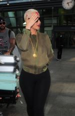 AMBER ROSE at Heathrow Airport in London 04/20/2015