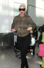 AMBER ROSE at Heathrow Airport in London 04/20/2015