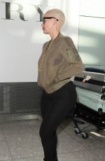 AMBER ROSE at Heathrow Airport in London 04/20/2015