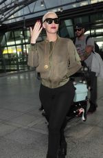 AMBER ROSE at Heathrow Airport in London 04/20/2015