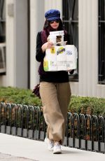 ANNE HATHAWAY Out and About in New York 04/23/2015