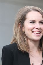 BRIDGIT MENDLER on the Set of Extra in Los Angles