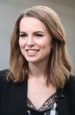 BRIDGIT MENDLER on the Set of Extra in Los Angles
