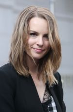 BRIDGIT MENDLER on the Set of Extra in Los Angles