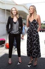 BRIDGIT MENDLER on the Set of Extra in Los Angles