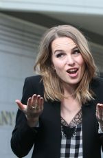 BRIDGIT MENDLER on the Set of Extra in Los Angles