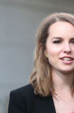BRIDGIT MENDLER on the Set of Extra in Los Angles